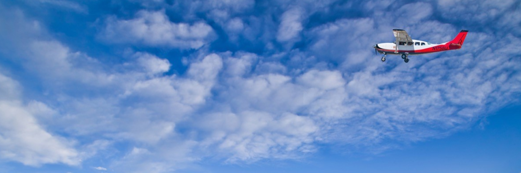 Small aircraft with blue sky