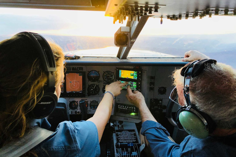 Two people in the cockpit during flight instruction